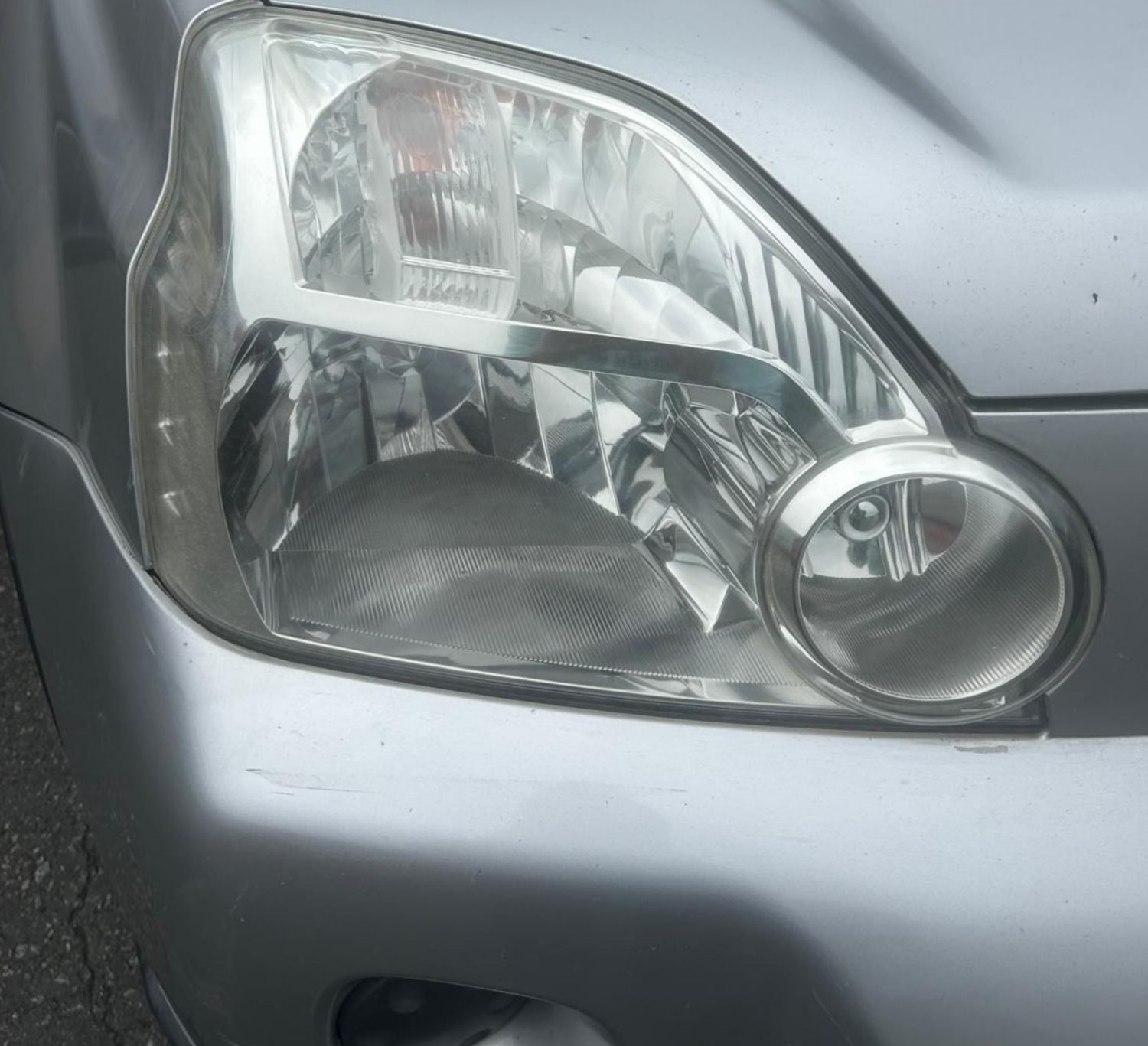 Nissan X-Trail headlight after restoration — crystal clear